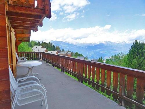 a patio with chairs and a table on a balcony at Chalet Albert in Les Collons