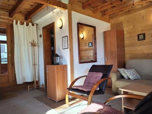 a living room with a couch and a table at Brvnara M&M Kaludjerske bare in Kaludjerske Bare