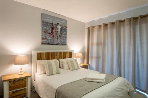 Postel nebo postele na pokoji v ubytování Villa Delfini F6