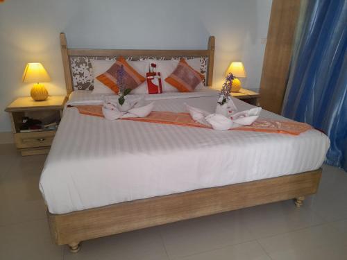 Ένα ή περισσότερα κρεβάτια σε δωμάτιο στο Panjai's Place