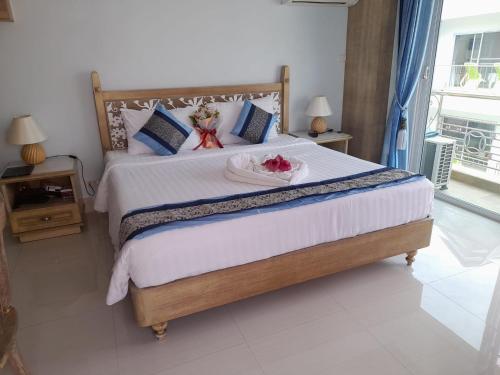 Ένα ή περισσότερα κρεβάτια σε δωμάτιο στο Panjai's Place