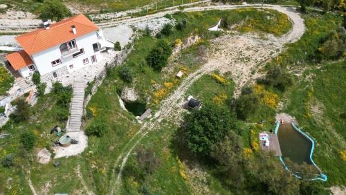 an aerial view of a house on a hill at Zevari studio with amazing views! in Folhadosa