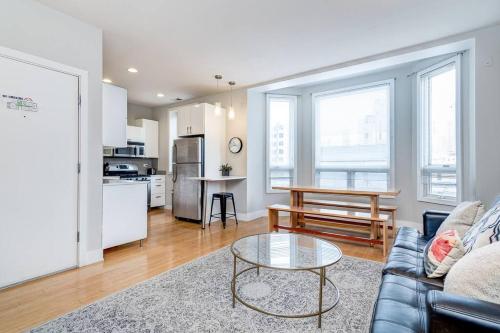 a living room with a couch and a table at Cozy Beautiful Downtown Unit CHI in Prime River North Location near Mag Mile - 2 in Chicago