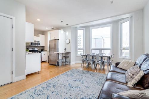 a living room with a couch and a table with chairs at Cozy Beautiful Downtown Unit CHI in Prime River North Location near Mag Mile - 1 in Chicago