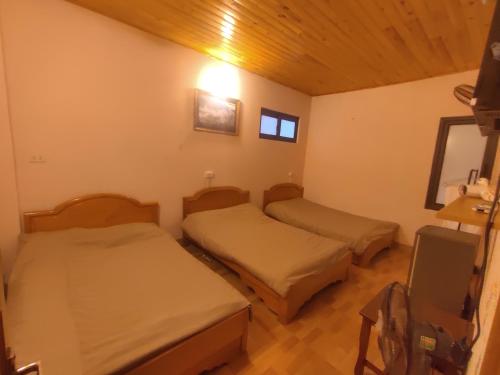 Postel nebo postele na pokoji v ubytování Núi Homestay Sa Pa