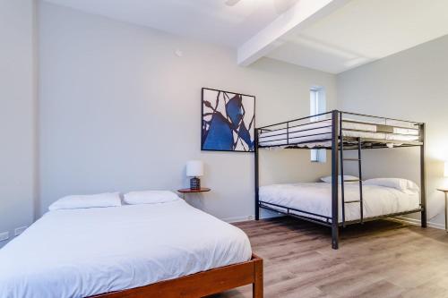 a bedroom with two beds and a bunk bed at Beautifully Remodeled Second Floor Flat in River North with Private Rooftop - 2S in Chicago
