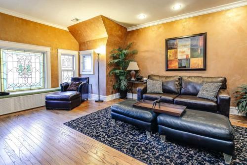 a living room with a leather couch and chairs at Historic and Unique Brownstone in Gold Coast - Downtown - 3 in Chicago