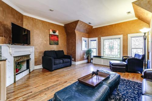 a living room with a couch and a fireplace at Historic and Unique Brownstone in Gold Coast - Downtown - 3 in Chicago