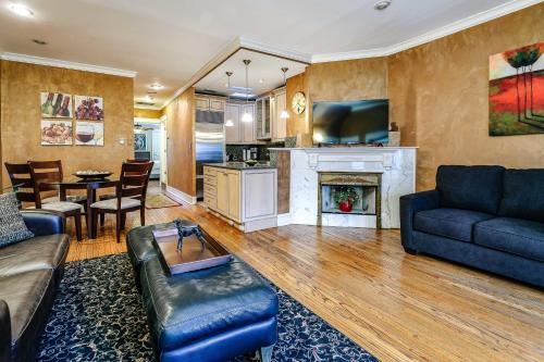 a living room with a couch and a fireplace at Historic and Unique Brownstone in Gold Coast - Downtown - 3 in Chicago