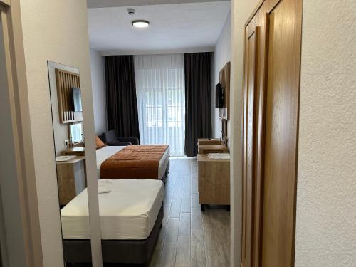 Ένα ή περισσότερα κρεβάτια σε δωμάτιο στο Hotel Panaya