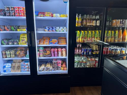 a refrigerator filled with lots of food and drinks at Hannover - PHIL & MAX Hotels und Apartments Messe in Hannover