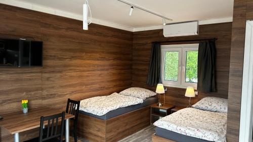 Postel nebo postele na pokoji v ubytování Apartmány Štramberk