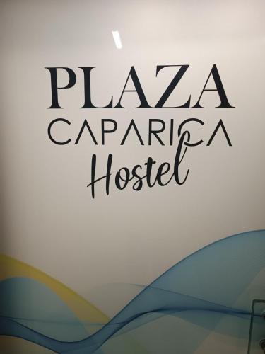 a sign for a pizza carnegie hospital at Plaza Caparica Hostel in Costa da Caparica