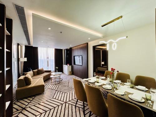 a living room with a dining table and a couch at Fortune Ranjit Vihar, Amritsar - Member ITC Hotels' Group in Amritsar