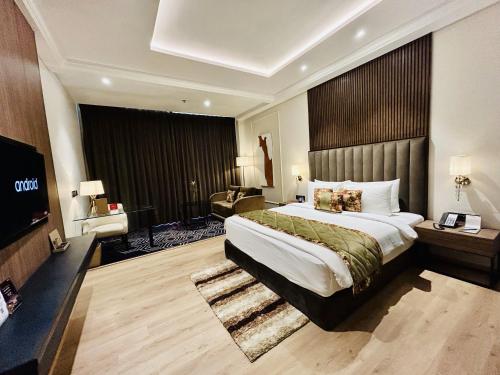 a hotel room with a large bed and a television at Fortune Ranjit Vihar, Amritsar - Member ITC Hotels' Group in Amritsar
