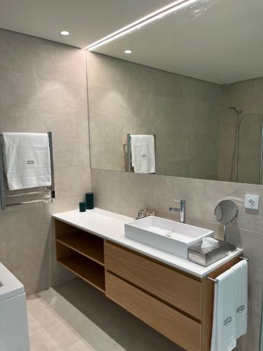 a bathroom with a sink and a mirror at PORTO - Penafiel - QUINTA DE SANTIAGO COUNTRY HOUSE in Penafiel