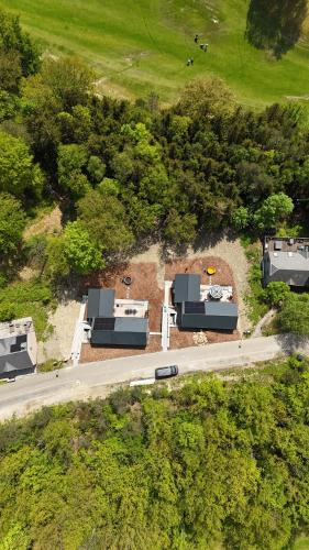 an overhead view of a road with houses and trees at Living Lodges - Durbuy in Durbuy