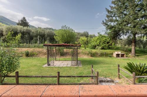 a gazebo in the middle of a field at Tenuta Cerbaiola with Pool, Garden & Parking in Borgo a Mozzano