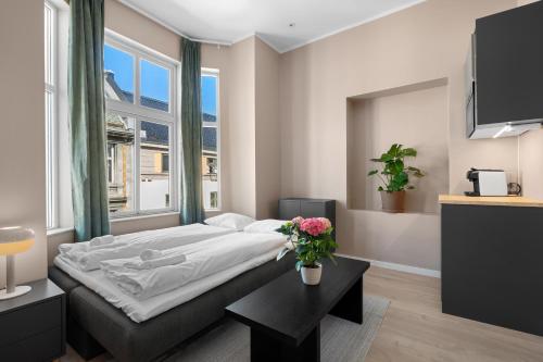 Ένα ή περισσότερα κρεβάτια σε δωμάτιο στο Bohemian Hotel - Self-Service