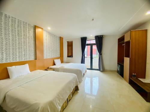 Ένα ή περισσότερα κρεβάτια σε δωμάτιο στο Sunny 1 Hometel Vinh Long