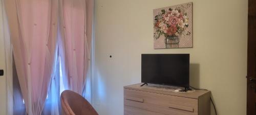 a tv sitting on top of a dresser in a room at Bed & Breakfast da Giovanni in Alessano