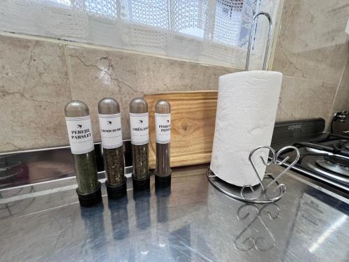 a group of four bottles of wine on a counter at Bahía Golondrina 2 in Ushuaia