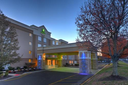 a rendering of a hotel building with blue lights at Holiday Inn Express & Suites West Long Branch - Eatontown by IHG in West Long Branch