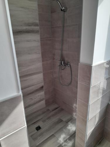 a shower with a glass door in a bathroom at 3 Room Penthouse Apartment with fantastic Seaview and big Terraces OASIS Ravda in Ravda