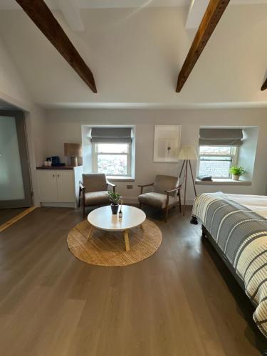 a bedroom with a bed and a table in a room at Number One Townhouse in Kinsale