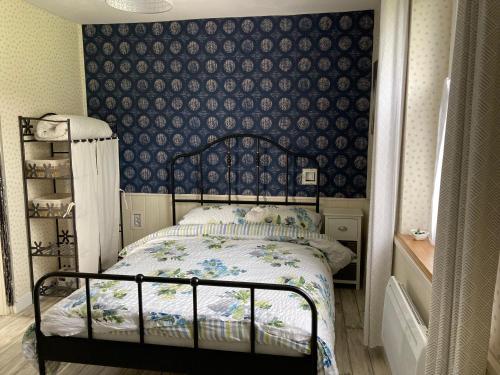 Postel nebo postele na pokoji v ubytování La Maison Bleue