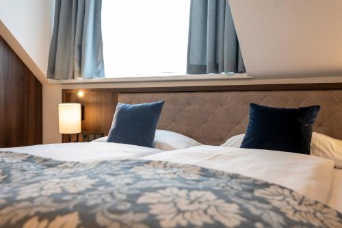 Postel nebo postele na pokoji v ubytování Salzburg Hotel Lilienhof
