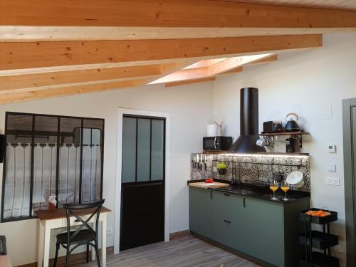a kitchen with wooden ceilings and a counter top at Belaustegi turismo rural in Ispáster