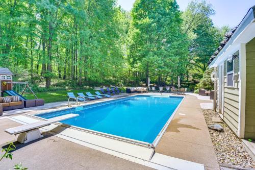a swimming pool in the backyard of a house at Huge Family Home with Pool - 13 Mi to Lake Michigan! in LaPorte