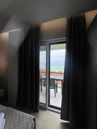 Кровать или кровати в номере Okkio Sea View