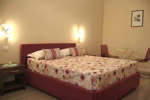 En eller flere senge i et værelse på Villa Gagliozzi