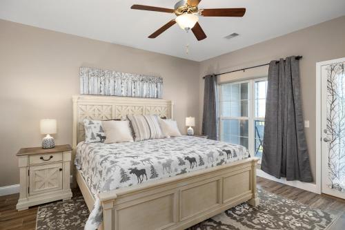 a bedroom with a bed and a ceiling fan at Condo #353 in Branson
