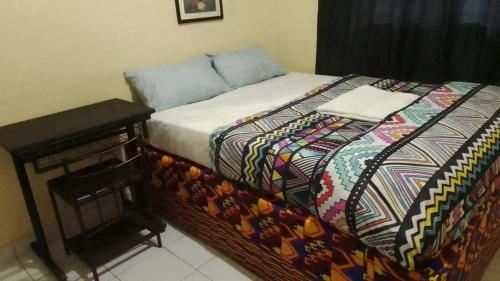 En eller flere senge i et værelse på RusticHome B&B, Kigali