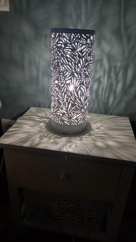 a black and white vase sitting on a table at Sur les Rives du Haut Allier in Blassac