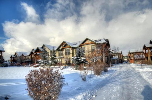 a large house in the snow with snow at Foxpoint 1678C by Moose Management in Park City