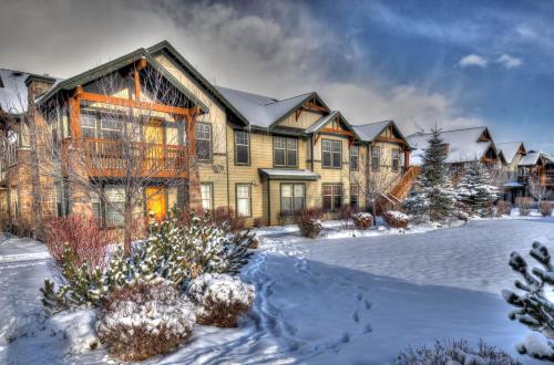a large house with snow on the ground at Foxpoint 1678C by Moose Management in Park City