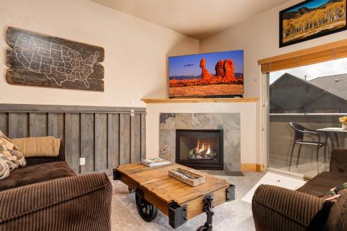 a living room with a couch and a fireplace at Foxpoint 1684-H3 by Moose Management in Park City