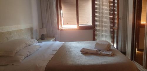 Ένα ή περισσότερα κρεβάτια σε δωμάτιο στο Casa Vacanze Carla