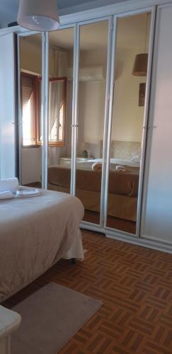 Ένα ή περισσότερα κρεβάτια σε δωμάτιο στο Casa Vacanze Carla