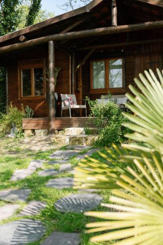 a house with a stone path in front of it at Les Glycines de Monchy- Chambres d'hôtes in Monchy-Humières