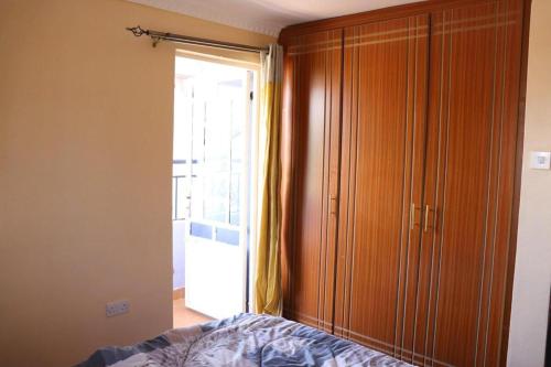 Ένα ή περισσότερα κρεβάτια σε δωμάτιο στο Immaculate 3 bedroom House in Ndenderu near Ruaka