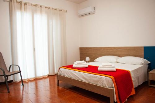 Postel nebo postele na pokoji v ubytování Casa Vacanze Caruso