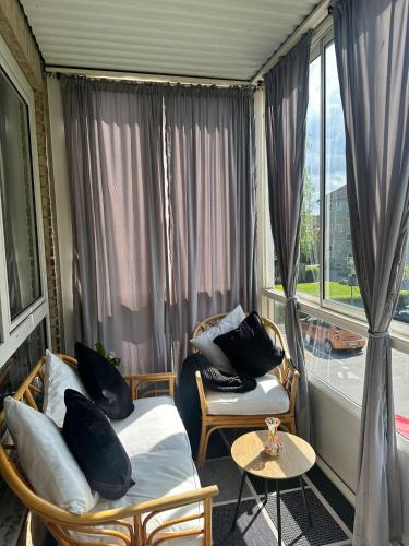 a room with two beds and a window at Cozy Bedroom in Søborg