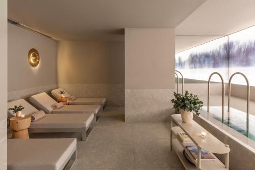a waiting room with beds and a large window at Casa Lucia Member of Melia Collection in Buenos Aires