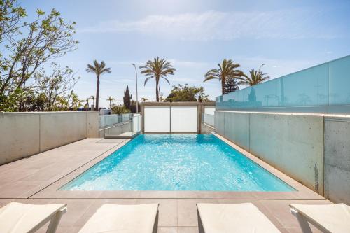 a swimming pool on the roof of a house at Kasino II RC Q in Monte Gordo