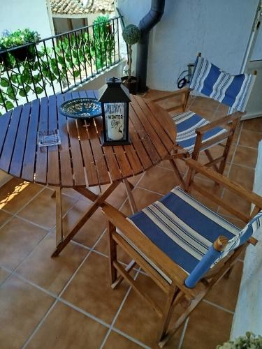 a wooden table and chairs in a room at Cazorla Rural in Quesada